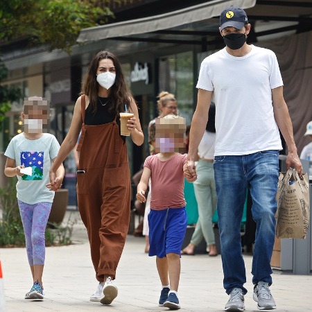 Ashton Kutcher and Mia Kunis with their children.